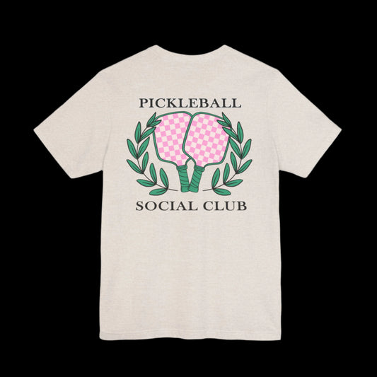 Back of tan graphic tee with ‘Pickleball Social Club’ text and vintage paddle logo