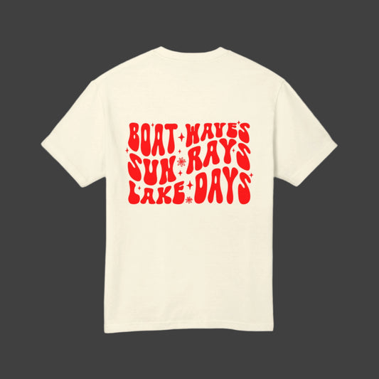 Back view of a summer t-shirt with trendy 'Boat-Waves-Sun-Rays-Lake-Days' red lettering in cream