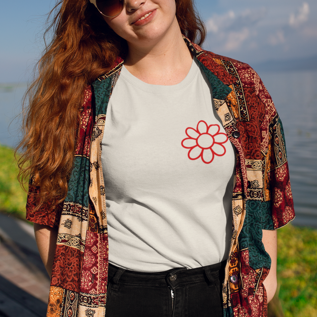 Person wearing a vintage boat and lake days t-shirt by the water.