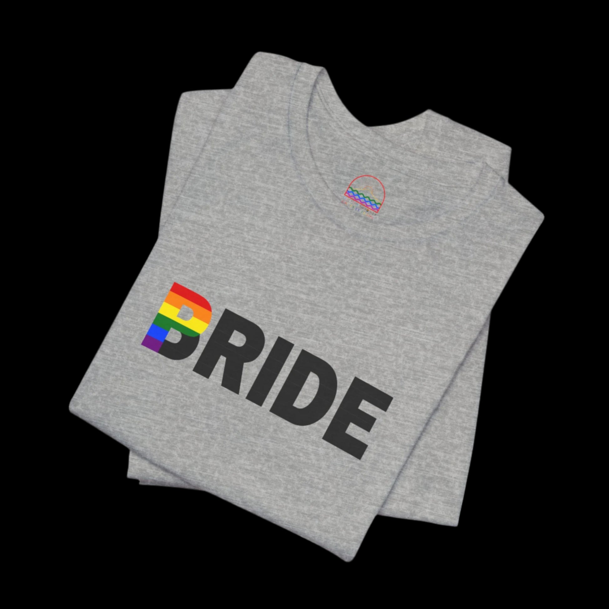 Close-up of 'Bride' rainbow design on white LGBTQ+ wedding T-shirt