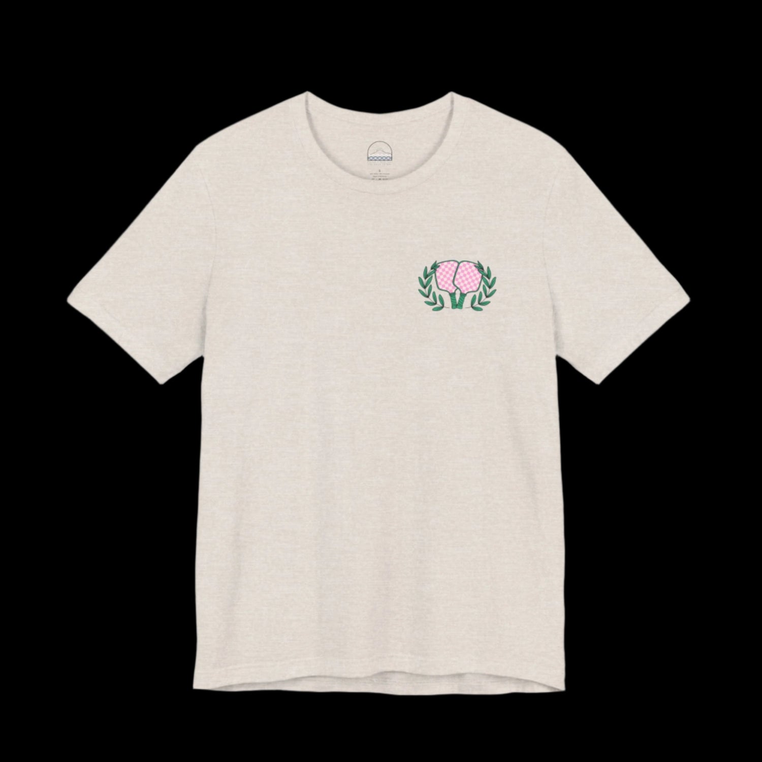 Tan pickleball t-shirt with small front chest logo of crossed paddles and green leaves